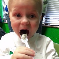 Kristy's son eating cake