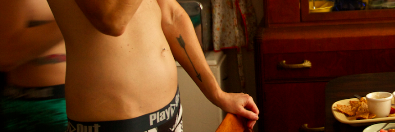 Breast Cancer Survivors Rock 'Flat Tops' in Powerful Underwear Ads Two models just wearing underwear with arms concealing bare chests