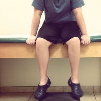 boy sitting in doctor office