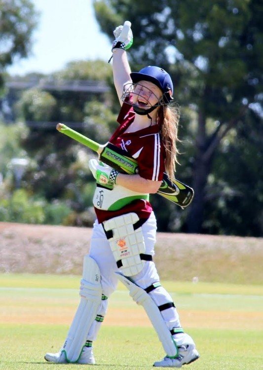 Madelyn Stewart playing cricket.