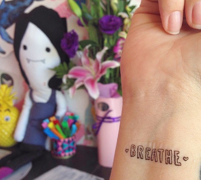 tattoo that says breathe