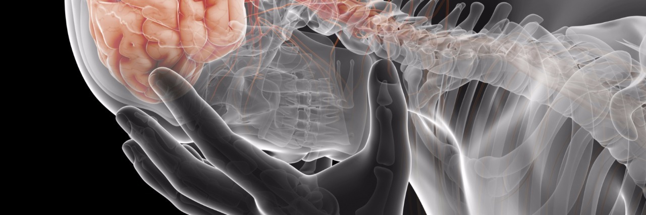 Understanding Migraine: What You Need to Know skeleton with brain visible holding head in hands