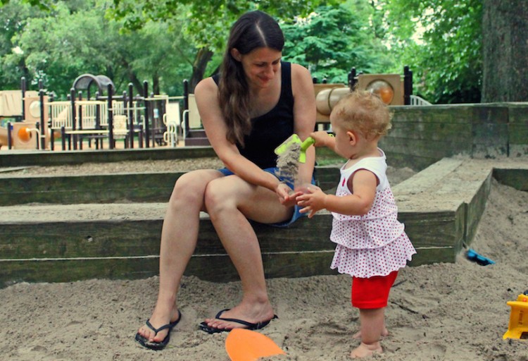 bethany conkell playing with daughter in sandbox