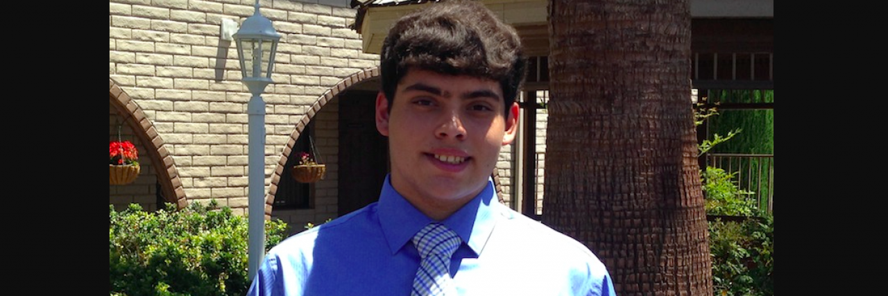 What You Should Know Before You Judge My Son's Mental Illness Teenager wearing a dress shirt and tie, smiling outside a building