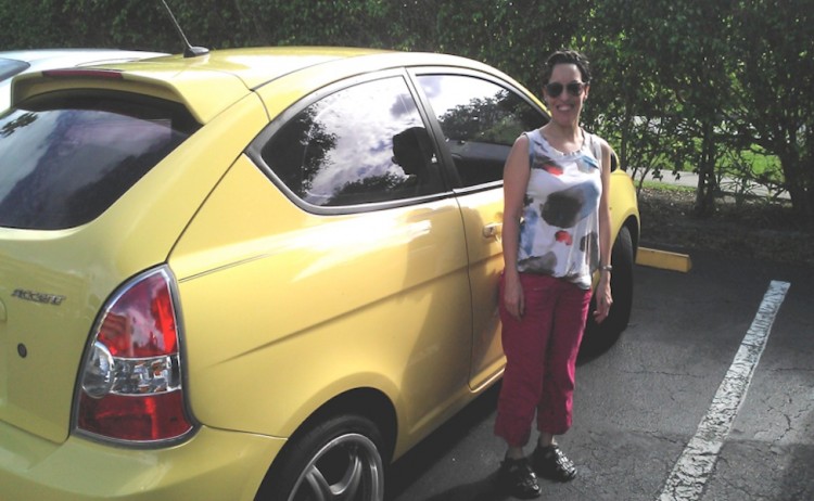 woman standing next to car