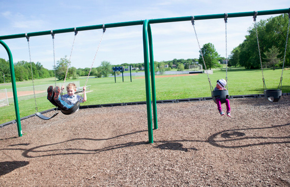 author's two children on the swings
