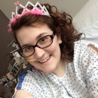 woman in a hospital wearing a crown