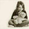 young girl with a teddy bear