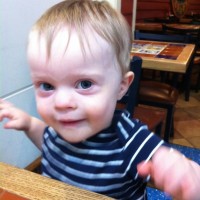 toddler boy sitting at chili's restaurant table