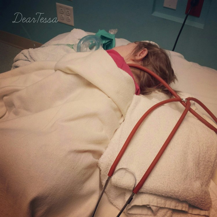 Girl lying in a hospital bed
