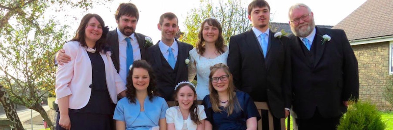 When Others Compare My Child With Autism to 'Normal' Kids family posing for pictures with bride and groom