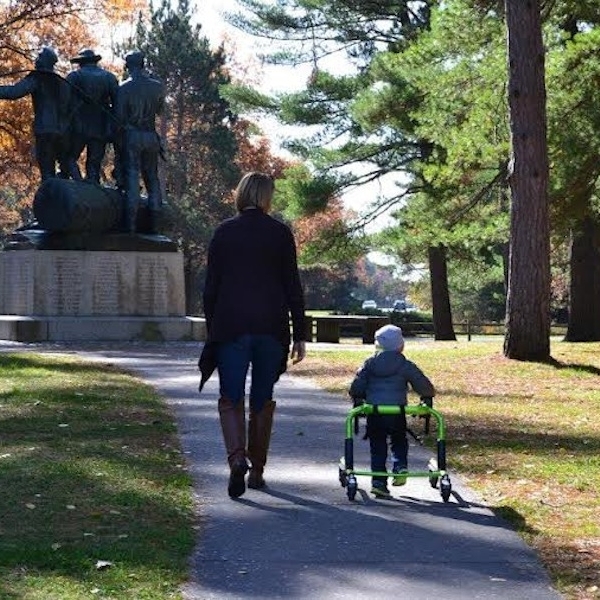 mother walking next to son