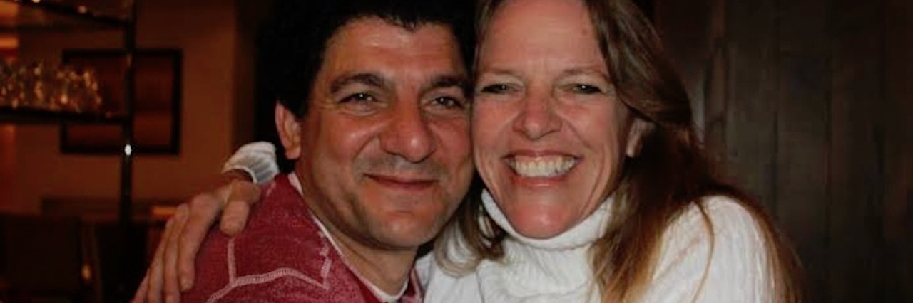 Asking My Husband If He Sacrificed Too Much for My Schizophrenia husband and wife sitting next to each other and hugging