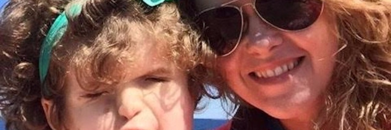 If I Had the Choice to Give My Blind Daughter Sight woman and her daughter in lifejackets on the lake