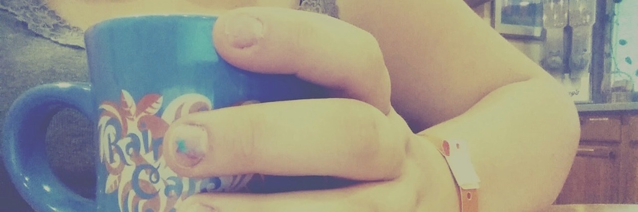 To Mothers Who Have to Let Their Babies With Health Conditions Go woman holding a mug