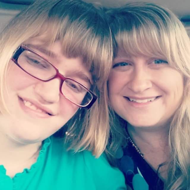 mom and daughter smiling