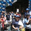 A group of people in wheelchairs at a parade