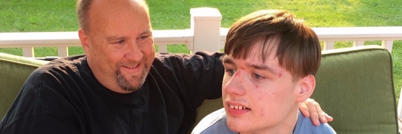 Realizing I Was Meant to Be a Special Needs Dad father and his son sitting outside