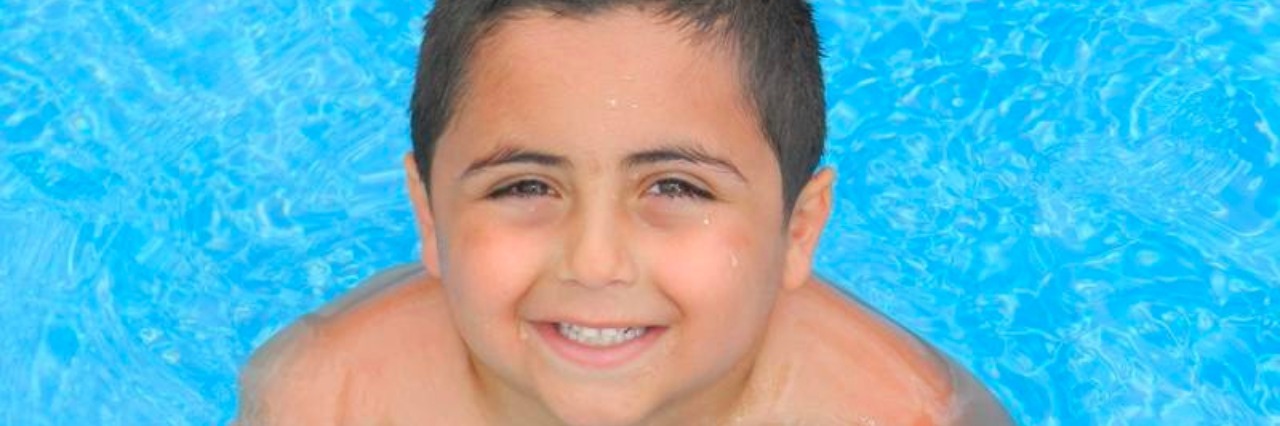 Siblings of Children With Illnesses Need More Attention boy in swimming pool