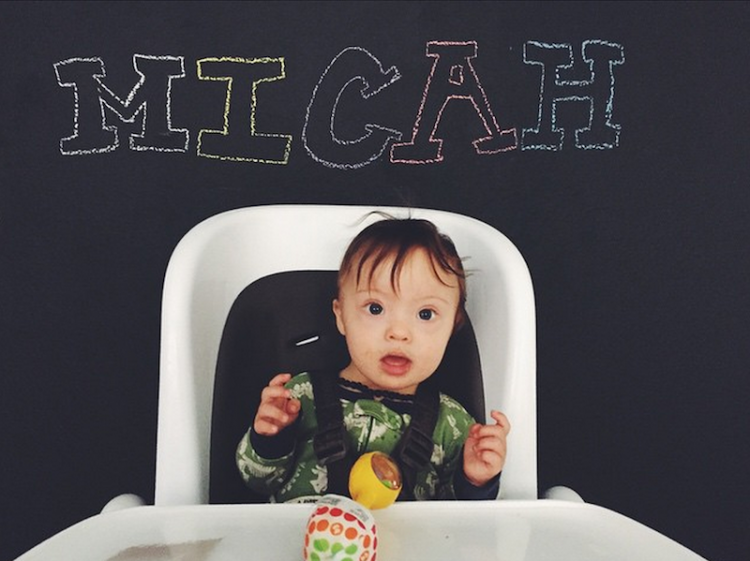 Ms. Booth's son micah in a highchair 