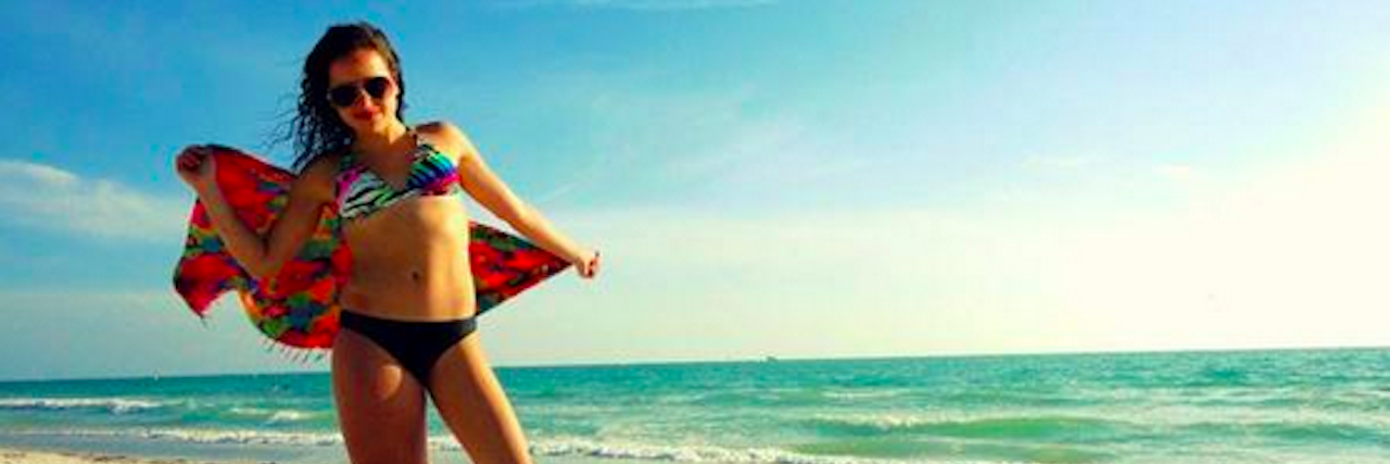 Teen Won't Let Parkes Weber Syndrome Keep Her From Wearing Bikini A photo of a girl in her bikini with text that says, "I won't let anyone dim my sunshine because they are blinded. I'll tell them to put on some sunglasses cause I was born this way."