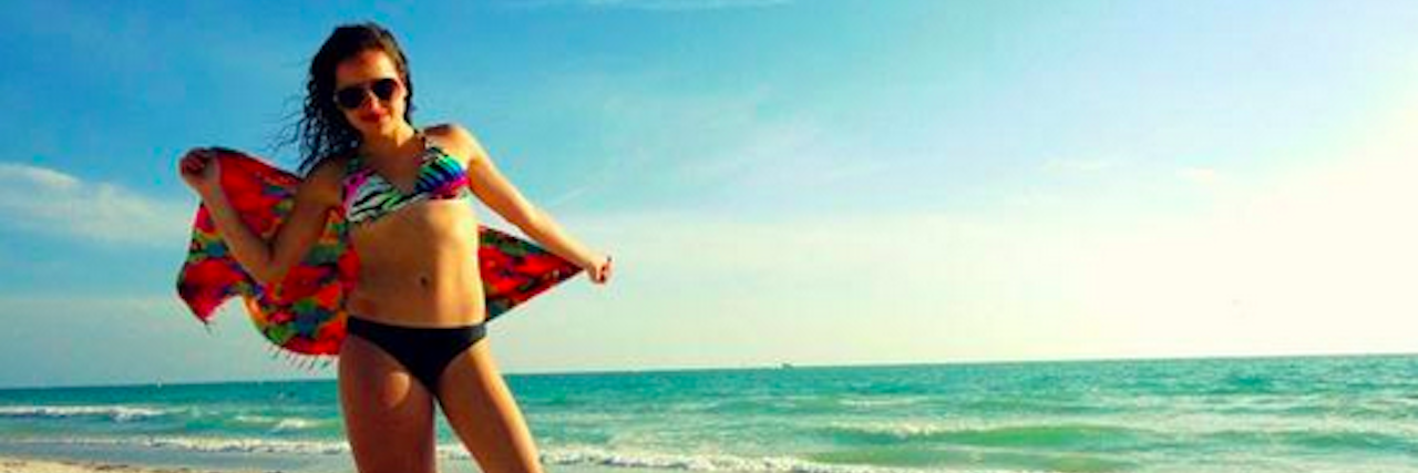 A photo of a girl in her bikini with text that says, "I won't let anyone dim my sunshine because they are blinded. I'll tell them to put on some sunglasses cause I was born this way."