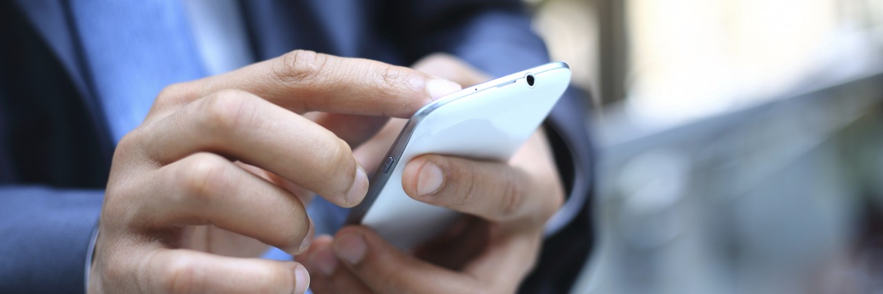 What This New App Will Do for People With Epilepsy Close up of a person using mobile phone