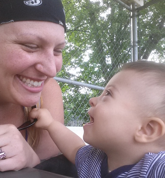 A woman smiling at her son, who had Down syndrome. 