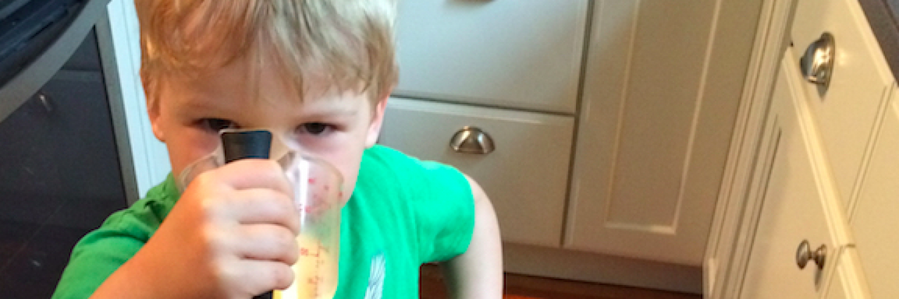 People's Dreaded Responses to My Son's Type 1 Diabetes Boy in green shirt drinking juice