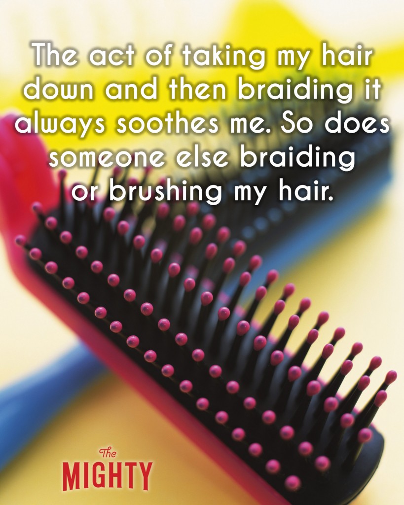 A photo of a pink hair brush on top of a blue hair brush. Accompanying text: [The act of taking my hair down and then braiding it always soothes me. So does someone else braiding or brushing my hair.]