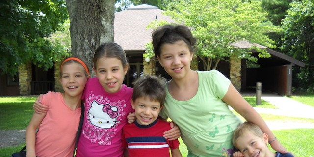 6 Things I Did to Help Find the Diagnosis for My Daughters' Rare Disorder five children smiling and hugging outside