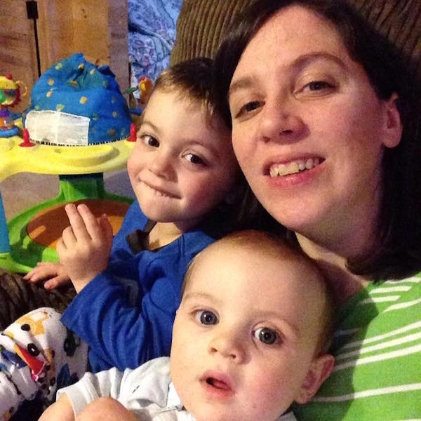 Lori and her two sons sitting together at home