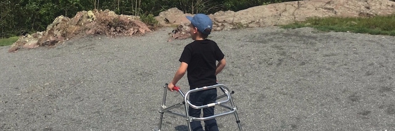 little boy looking out on landscape