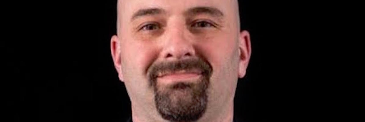 Masculinity and Having Difficulty Asking for Help man in suit smiling