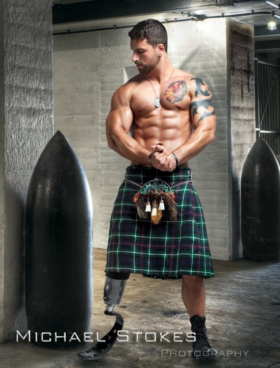 man with prosthetic leg wearing a green kilt