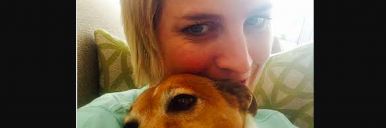 After Seeking Help, Here Are 10 Things I've Learned About Mental Health Woman with short blond hair holding little dog by her face