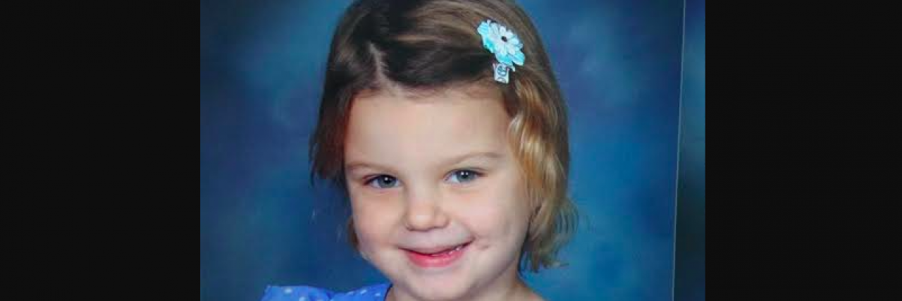 Response to Man at Disneyland About Handicap Lines Contributor's young daughter smiling in school photo