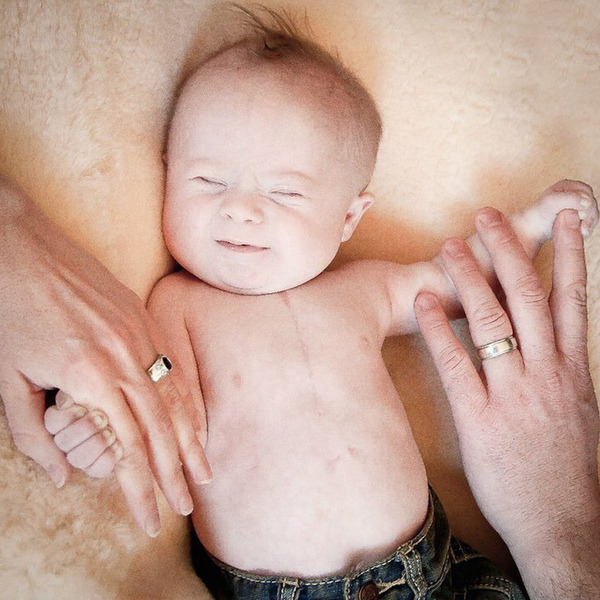 Ange Longbottom, baby with parents' hands