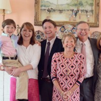 family takes photo together