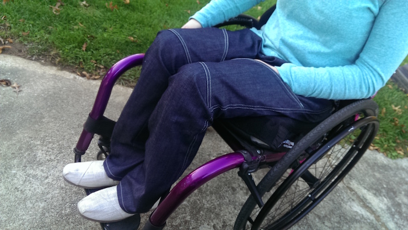 woman in a wheelchair wearing the jeans