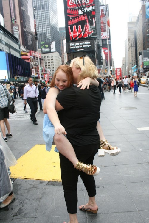 Madeline Stuart hugging her mom, Rosanne Stuart, near Times Square