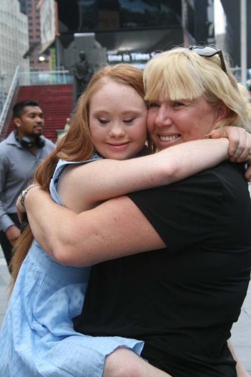 Madeline Stuart hugging her mom, Rosanne Stuart, near Times Square