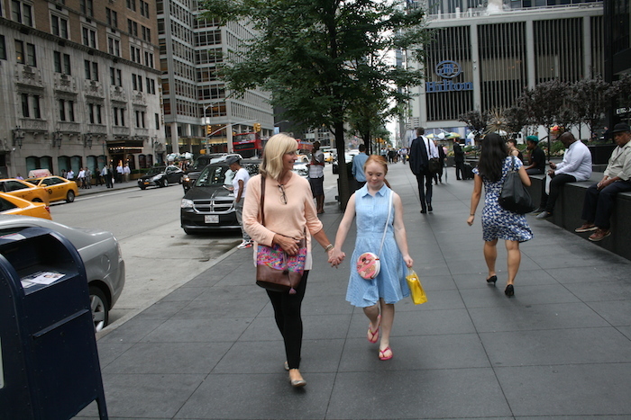 Madeline Stuart and her mom walking down New York street