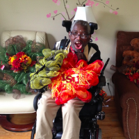 man in wheelchair showing his wreaths