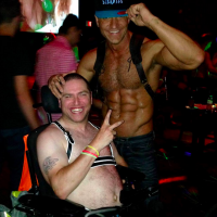 two men at deliciously disabled sex party