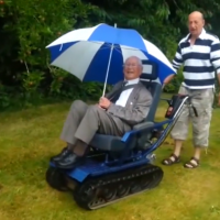 man in wheelchair designed like a tank