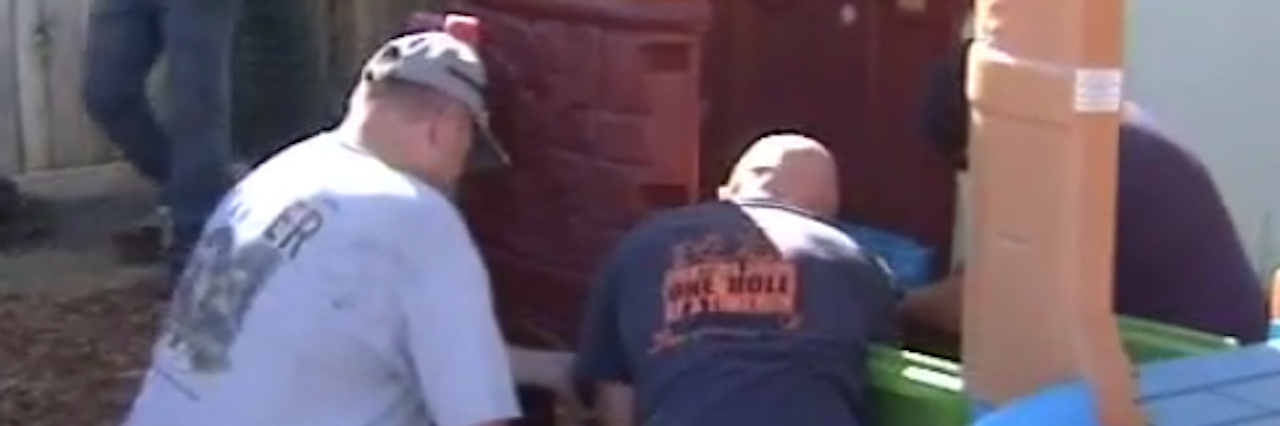 Hanford Police Replace Play Set Stolen From Kids With Disabilities police officers re-assemble children's playset