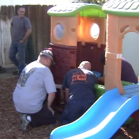 police officers re-assemble children's playset