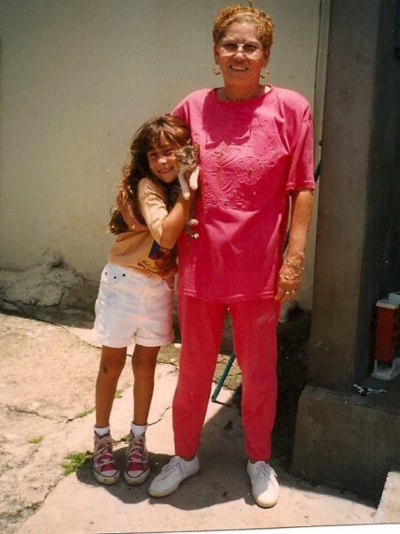 young girl with older woman and cat