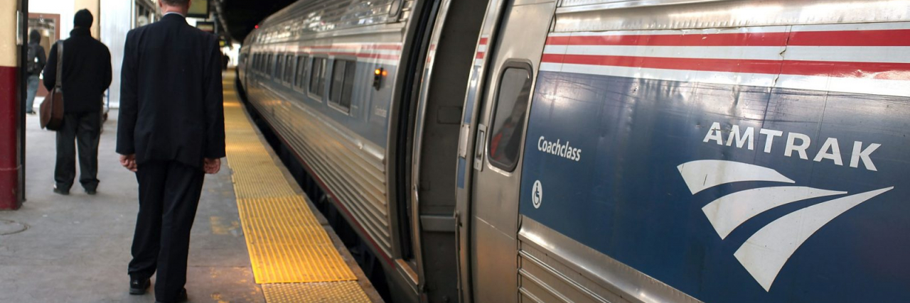 Lawsuit Claims Amtrak Discriminated Against a Man With Epilepsy Amtrack train waits in station
